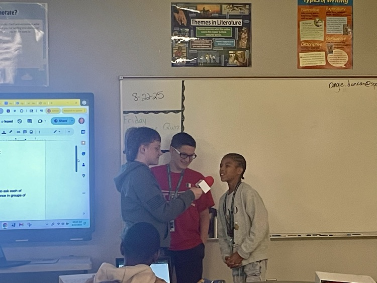 students interviewing each other
