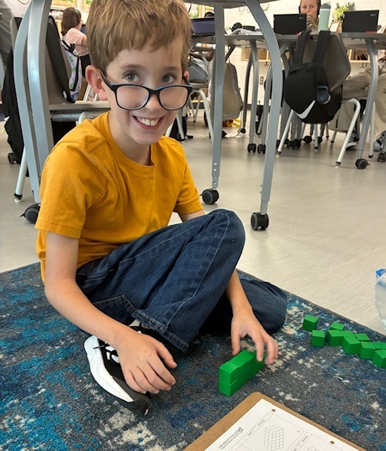 Jone's class using blocks to explore volume