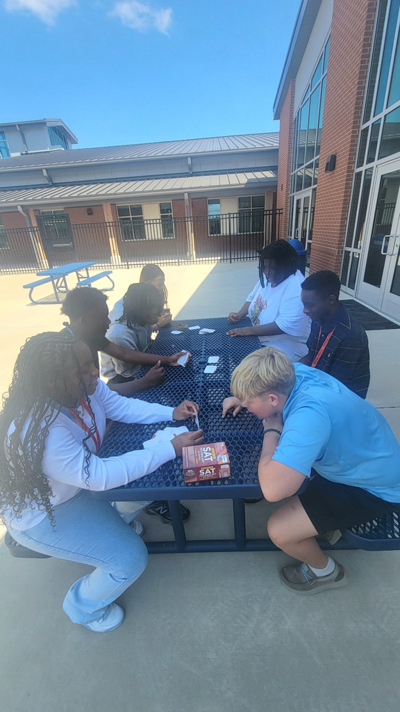 kids outside using flash cards