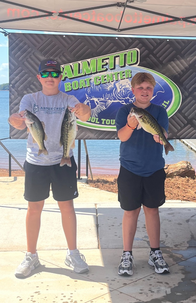 Bennett and Eli with fish