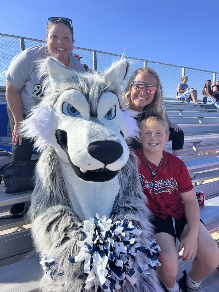 teacher or kids  with the mascot 