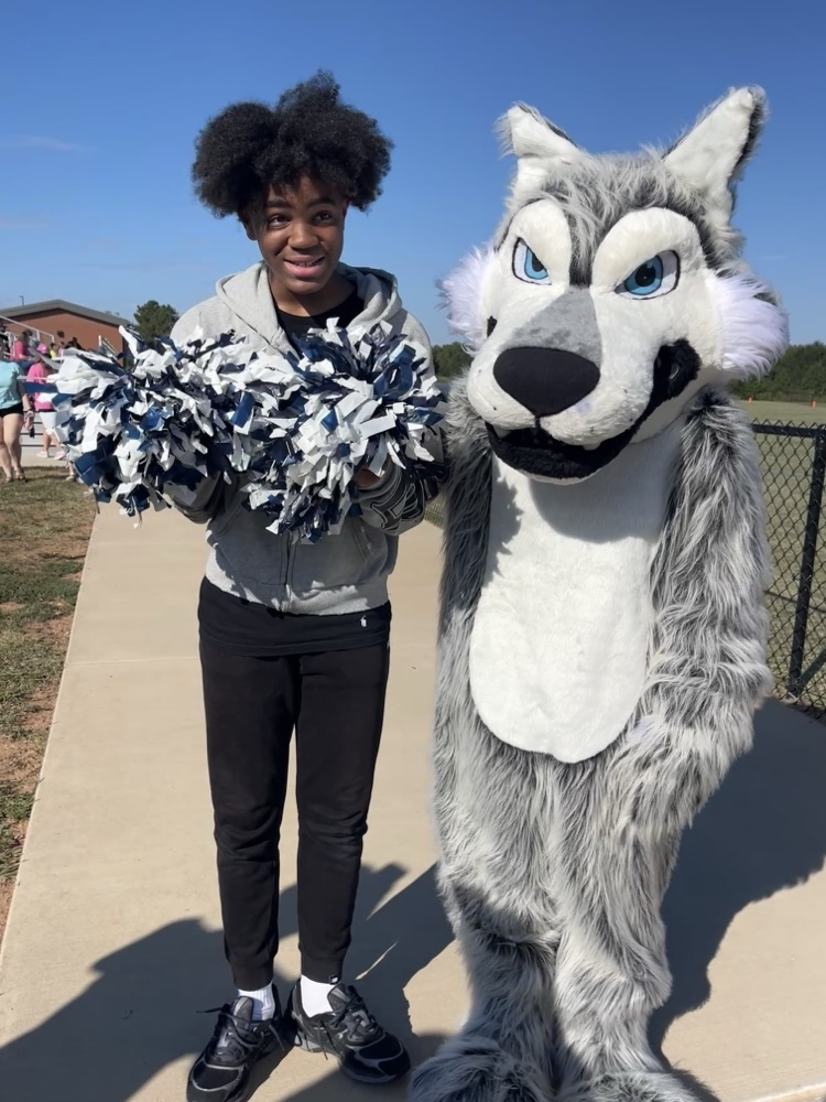 teacher or kids  with the mascot 