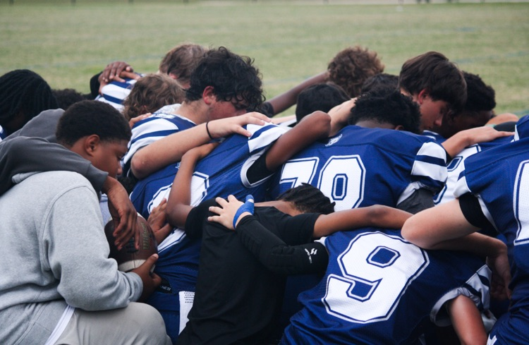boys in a huddle 