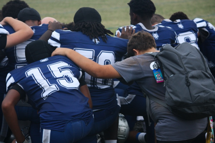 boys in a huddle 