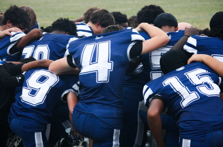 boys in a huddle 