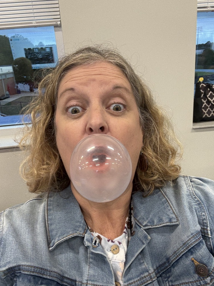 teacher blowing a bubble