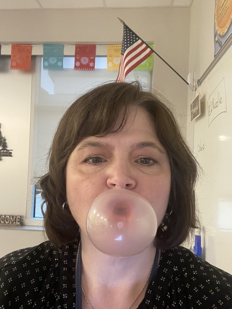 teacher blowing a bubble