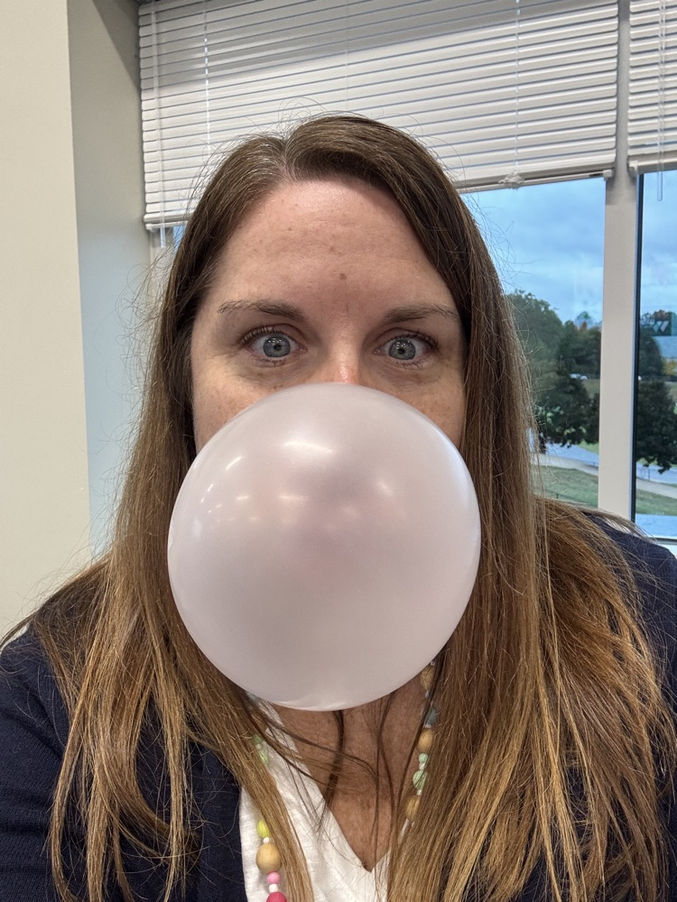teacher blowing a bubble