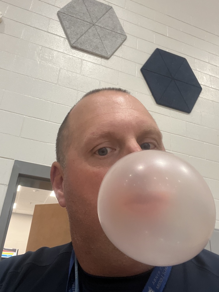teacher blowing a bubble