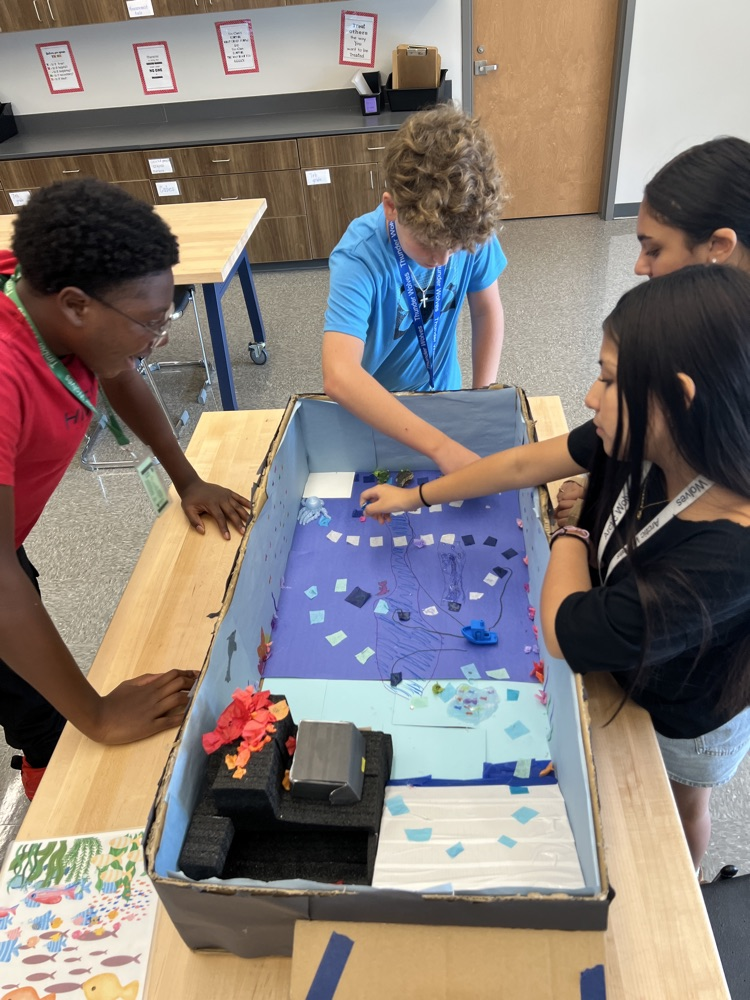 students playing board games they designed