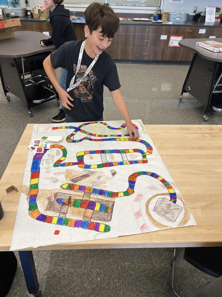 students playing board games they designed