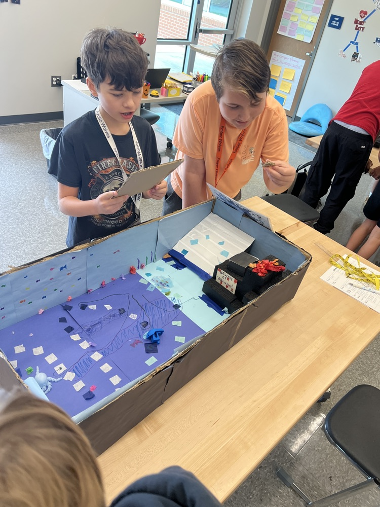 students playing board games they designed
