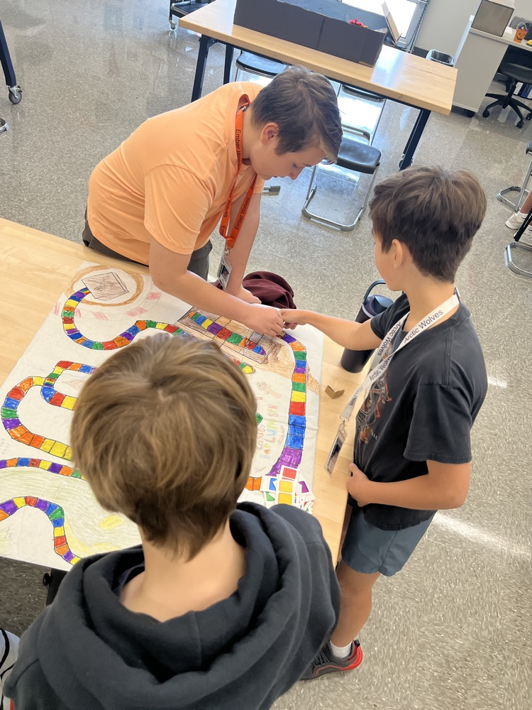 students playing board games they designed