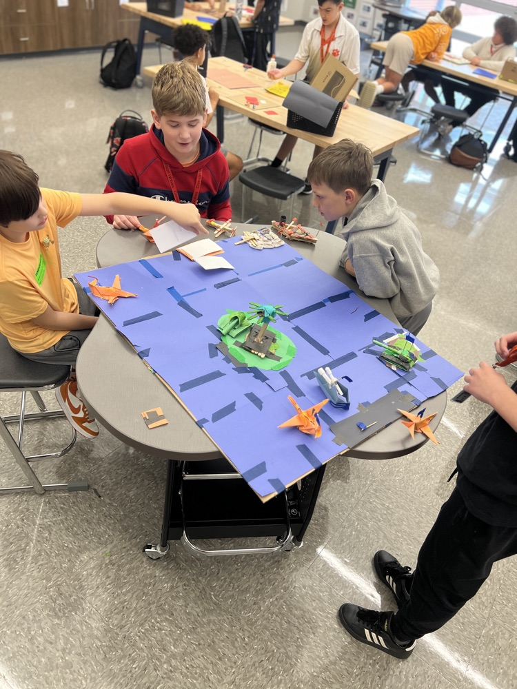 students playing board games they designed