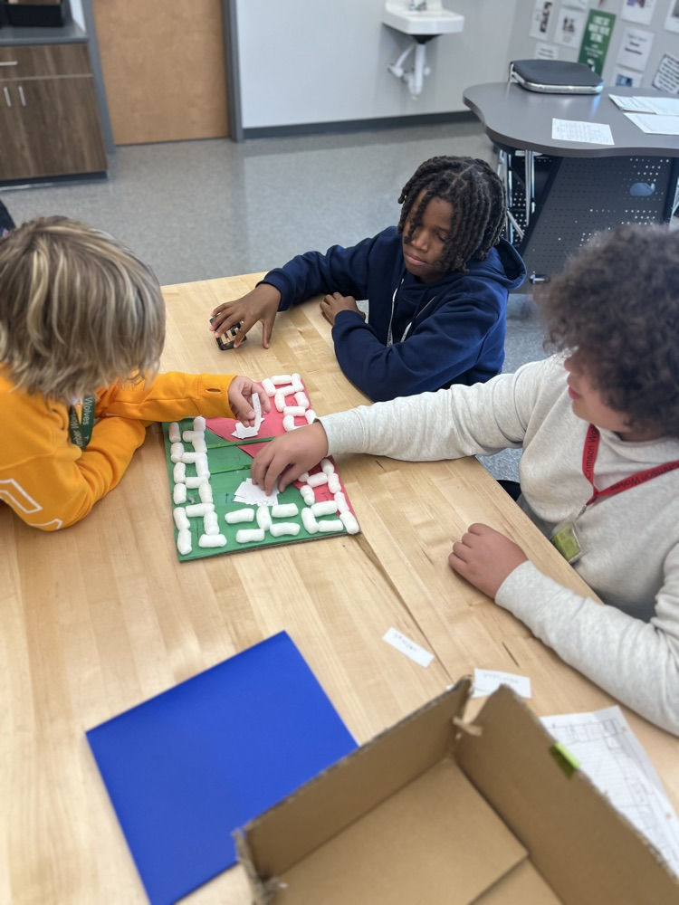 students playing board games they designed