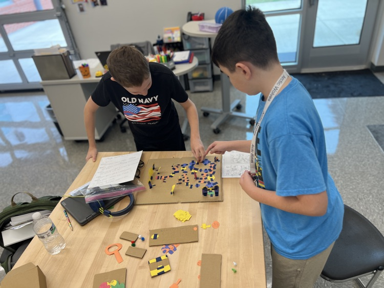 students playing board games they designed