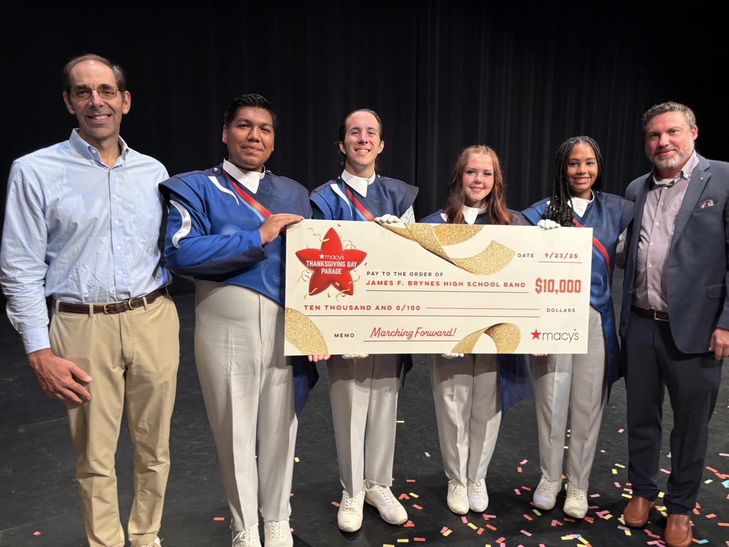 band students and director with Macy's check