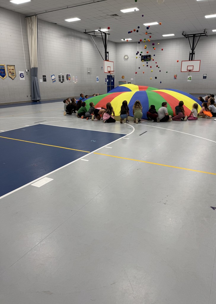 Students playing with the parachute in PE this week! 