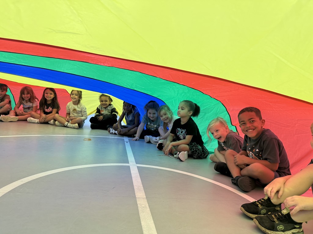 Students playing with the parachute in PE this week! 