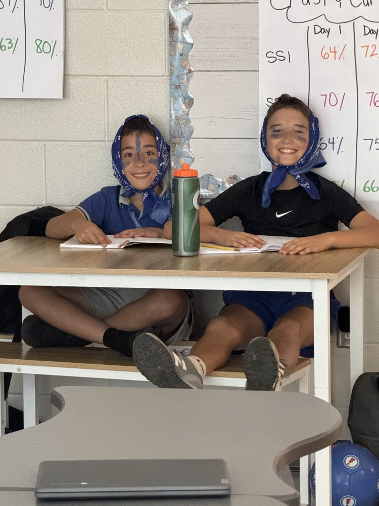 kids and teachers wearing house colors