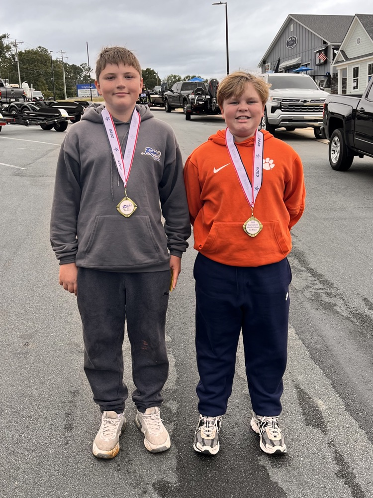 boys with medals around their neck