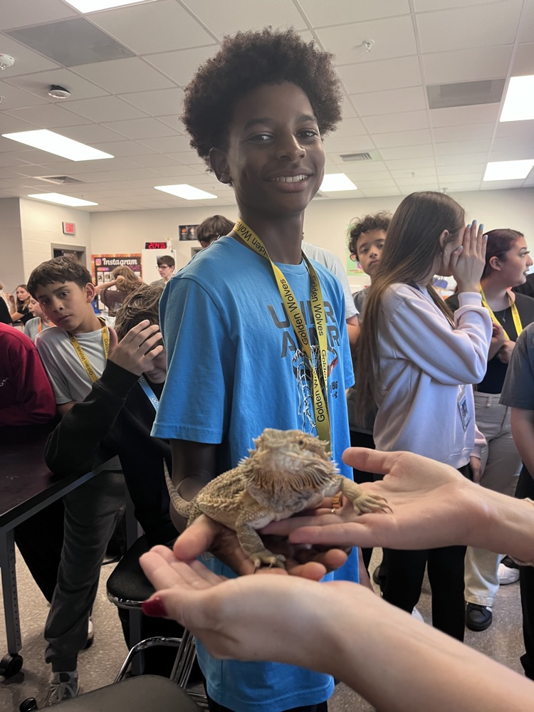 student with a lizard