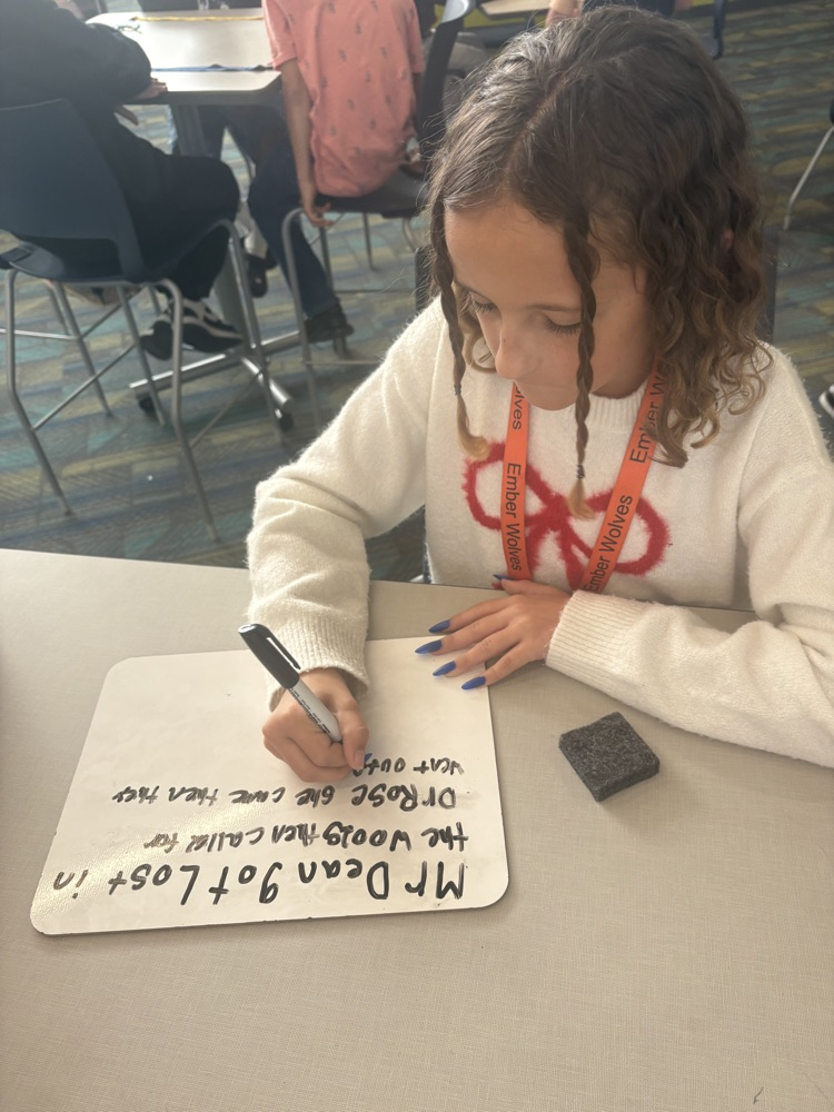 kids writing in the library