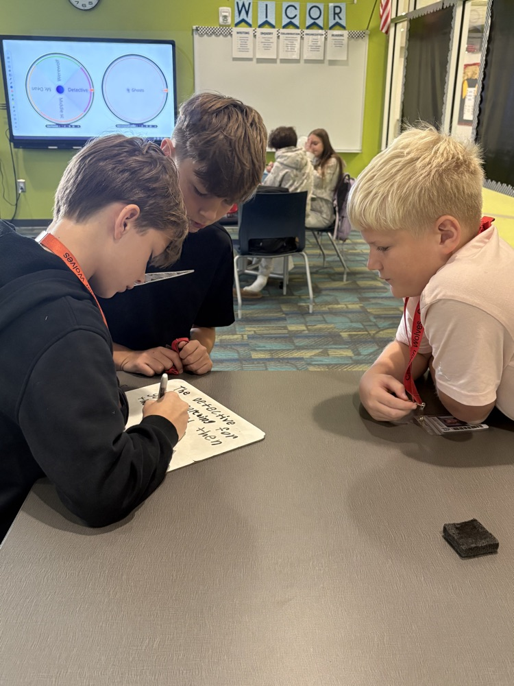 kids writing in the library