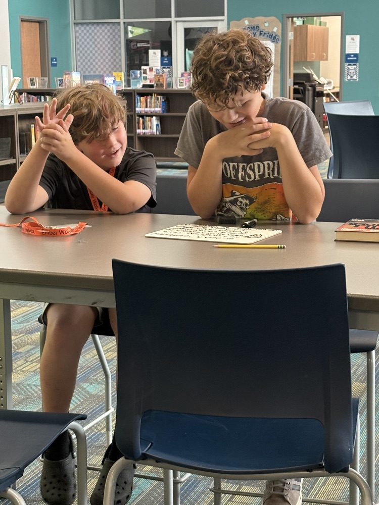 kids writing in the library