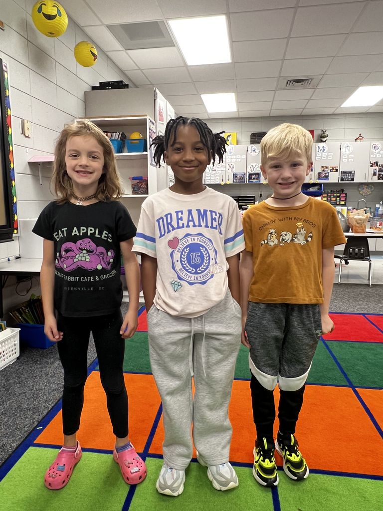 students wearing shirts with positive messages