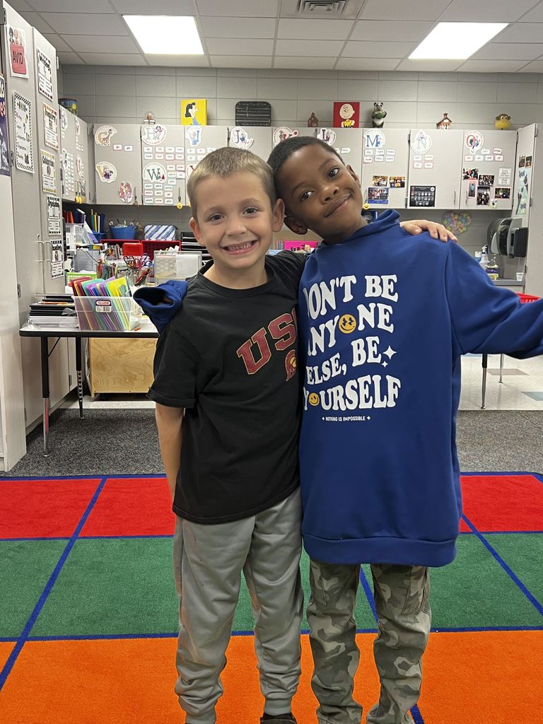 students wearing shirts with positive messages