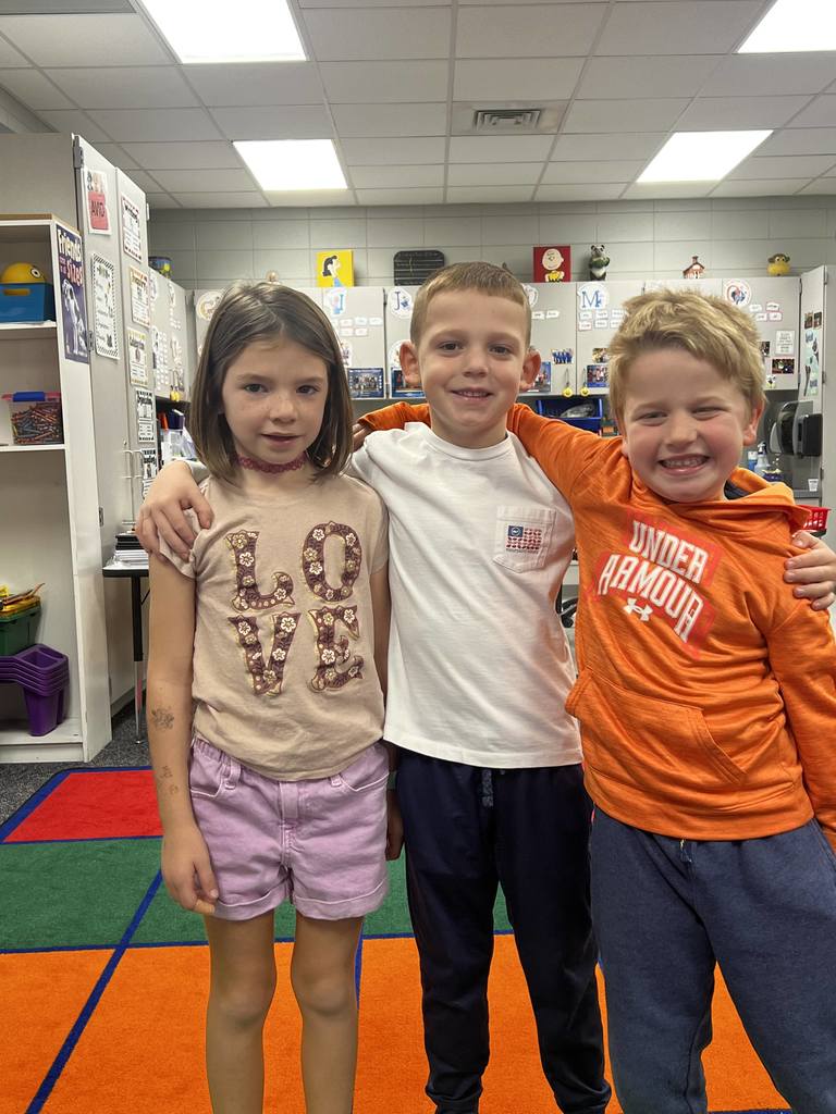 students wearing shirts with positive messages