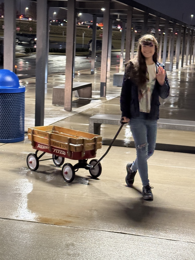 kids with funny items carrying their books