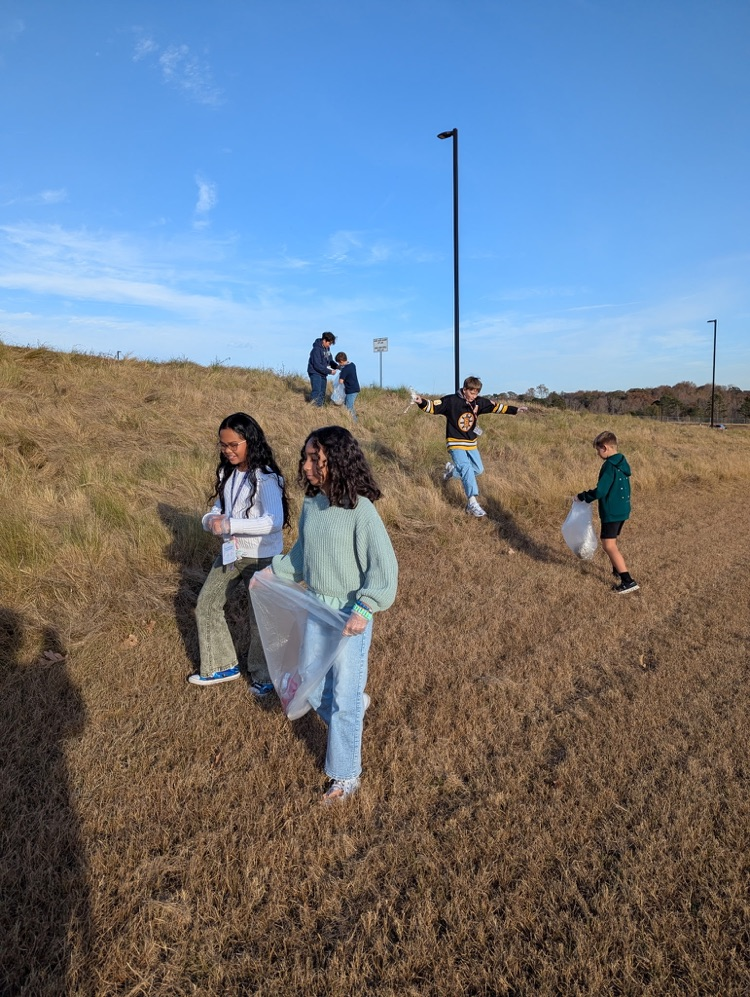 beta club members cleaning up