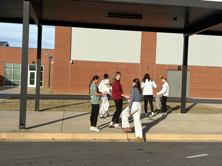 beta club members cleaning up