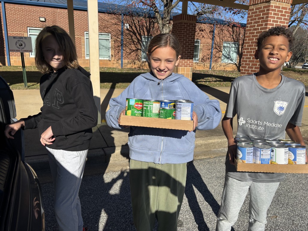 students loading canned food donations for delivery