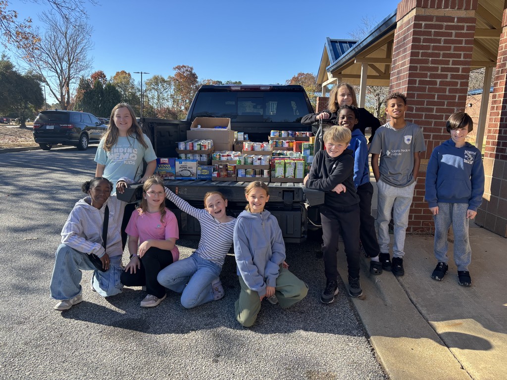 students loading canned food donations for delivery