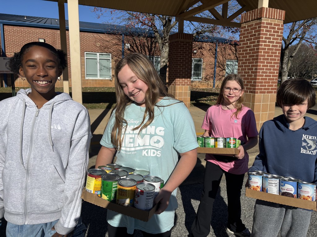 students loading canned food donations for delivery