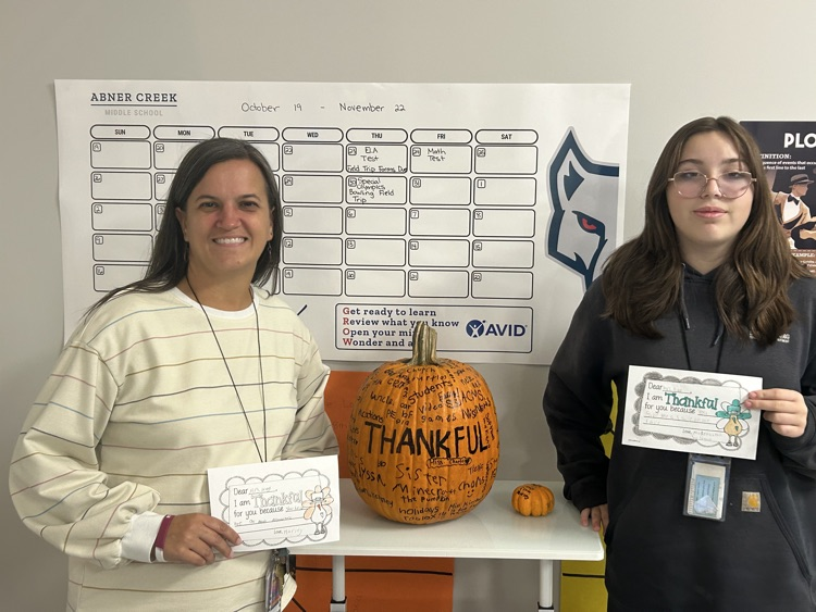 students giving teachers, thank you notes