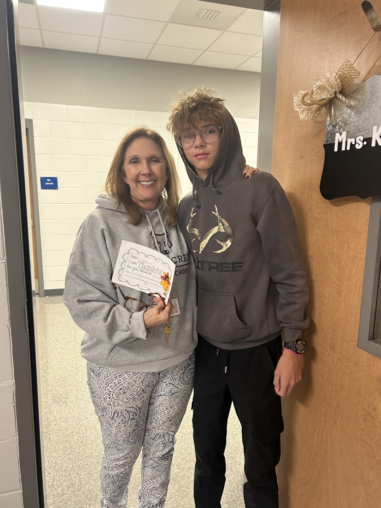 students giving teachers, thank you notes