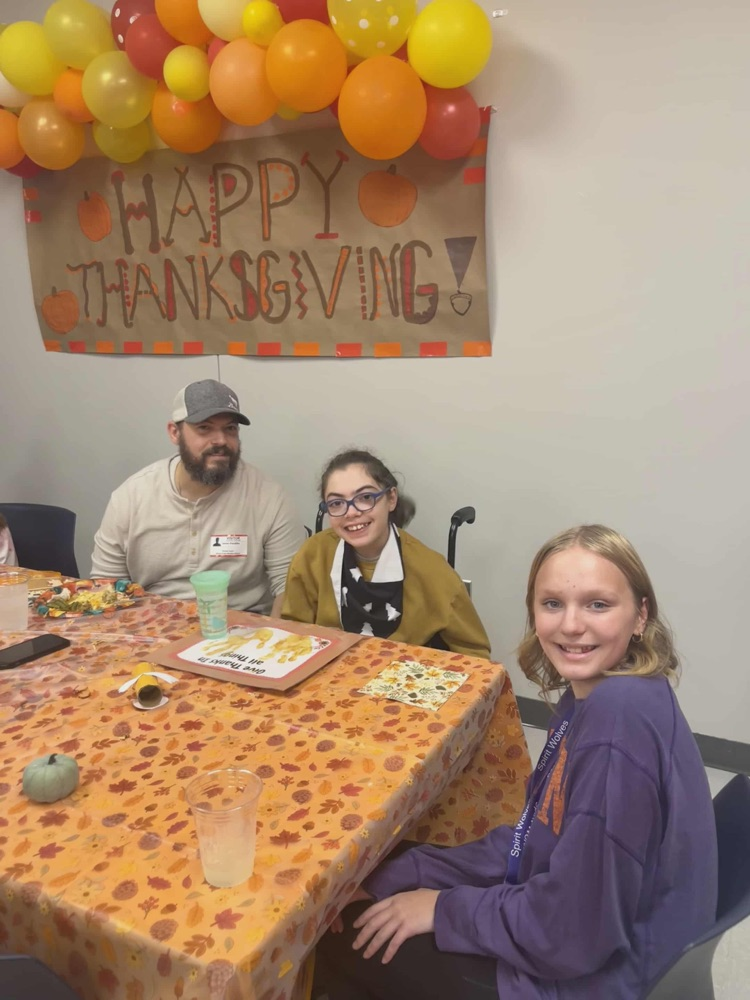 kids and adults at thanksgiving party 