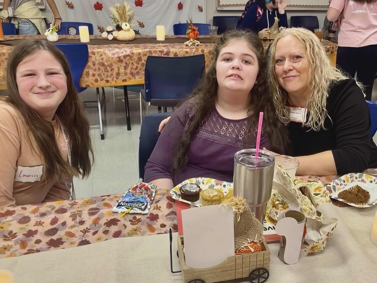 kids and adults at thanksgiving party 