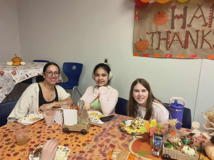 kids and adults at thanksgiving party 