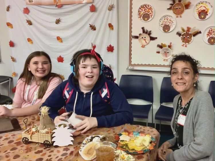 kids and adults at thanksgiving party 