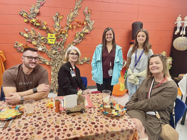 kids and adults at thanksgiving party 