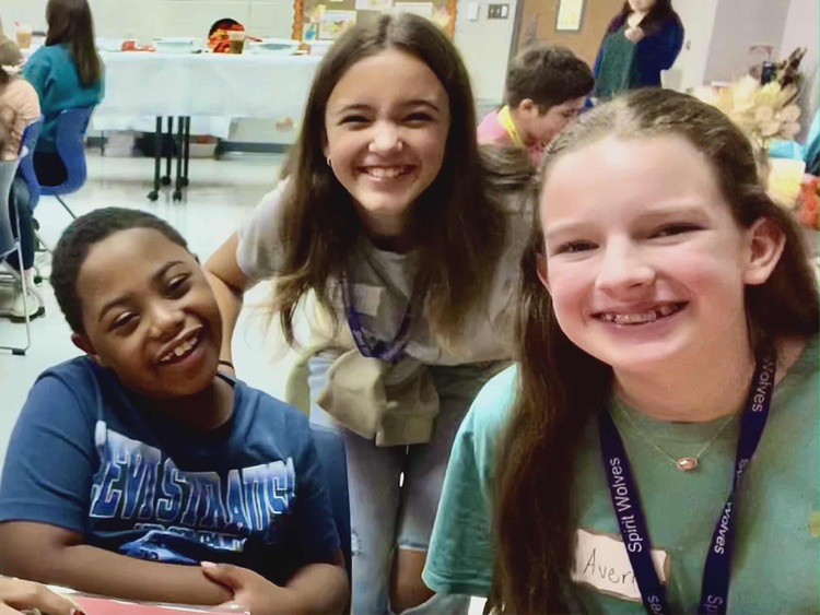 kids and adults at thanksgiving party 