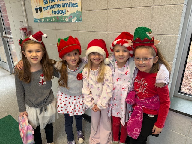 students wearing holiday headgear