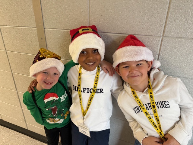 students wearing holiday headgear