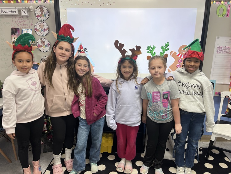 students wearing holiday headgear