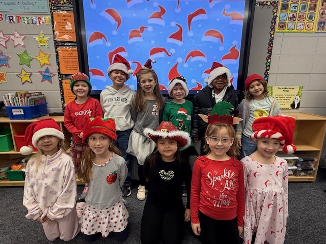 students wearing holiday headgear